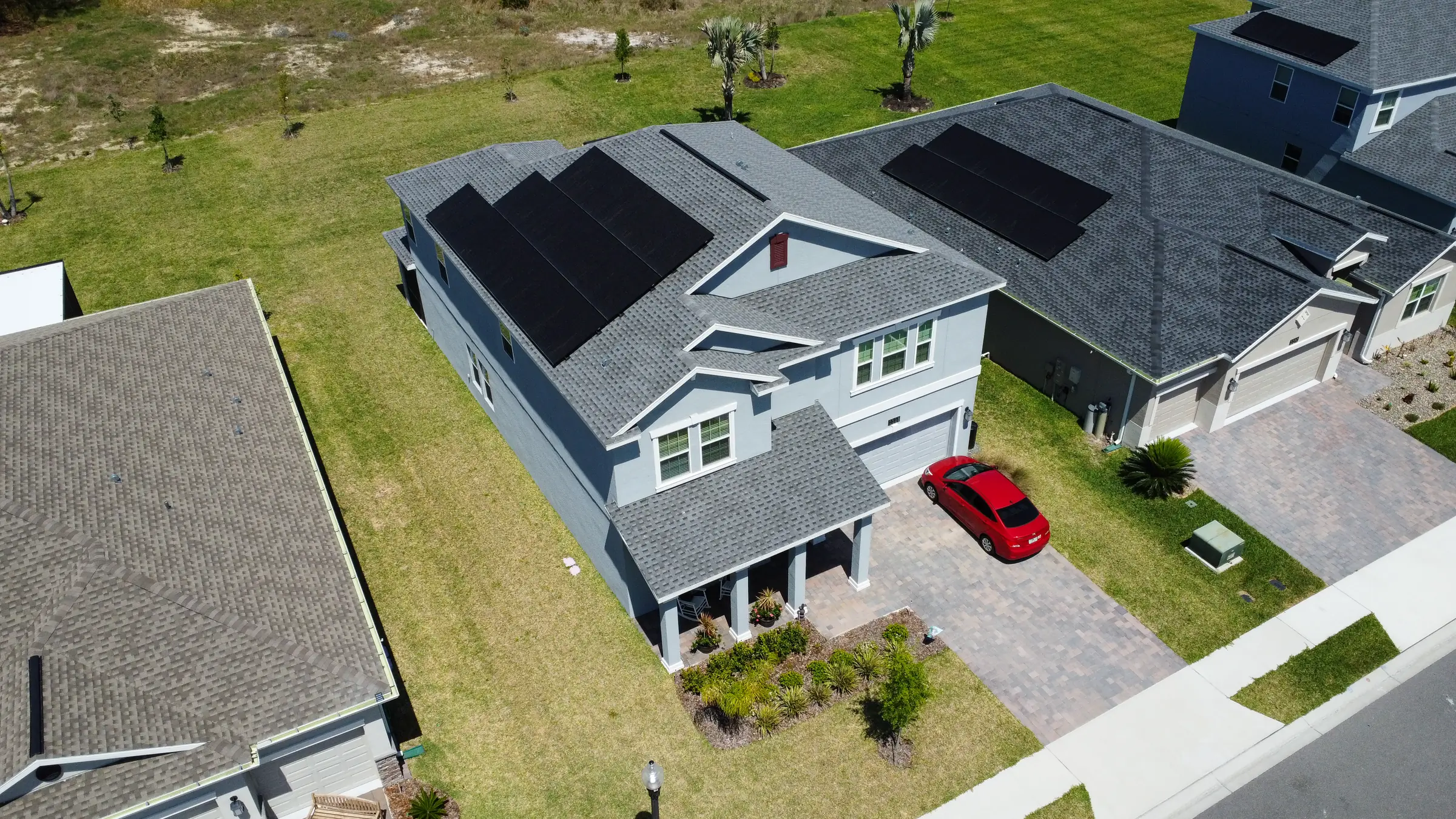 Aerial view of a Central Florida home with solar panels on the roof
